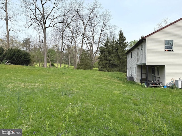view of yard featuring central AC unit