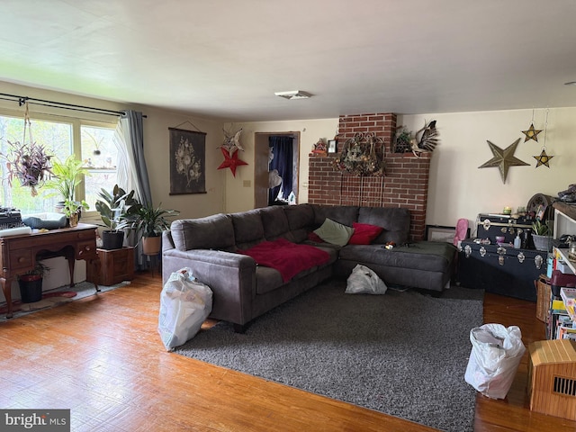 living room with wood finished floors and visible vents