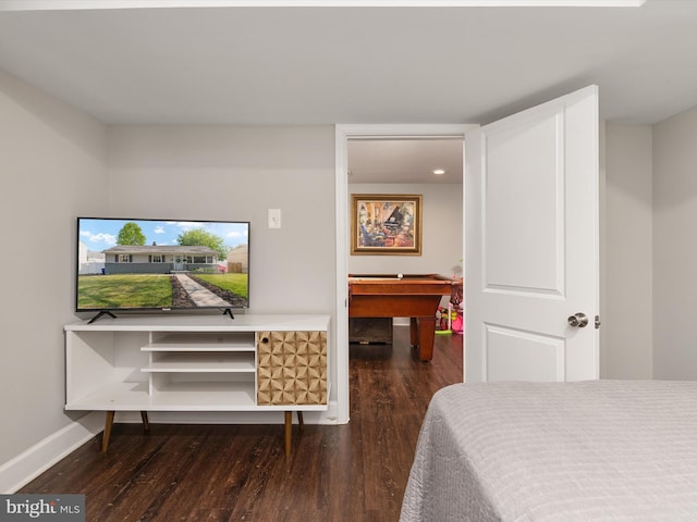 bedroom featuring pool table, baseboards, and wood finished floors