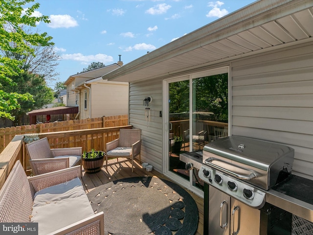 view of patio / terrace featuring fence, a grill, and a deck