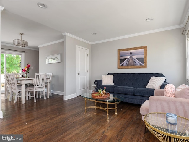 living room with wood finished floors, baseboards, a notable chandelier, ornamental molding, and recessed lighting