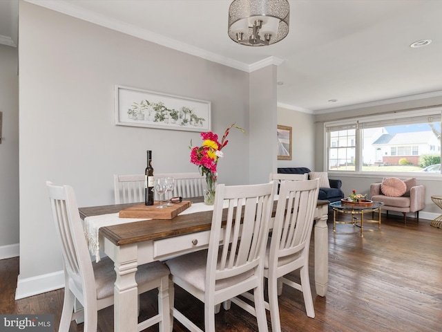 dining area with crown molding, an inviting chandelier, wood finished floors, baseboards, and recessed lighting