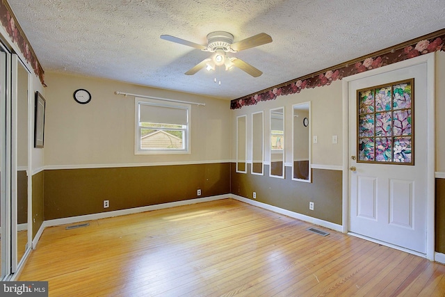 807 Riverside Dr, Pasadena, MD 21122 - empty room featuring ceiling fan, wood-type flooring, a textured ceiling, and baseboards