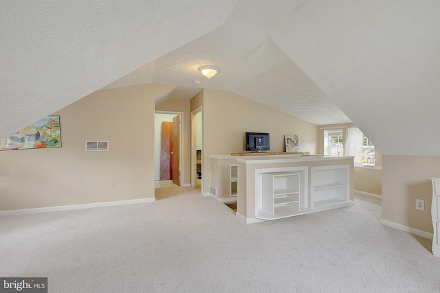 807 Riverside Dr, Pasadena, MD 21122 - bonus room with a textured ceiling, light colored carpet, lofted ceiling, and baseboards