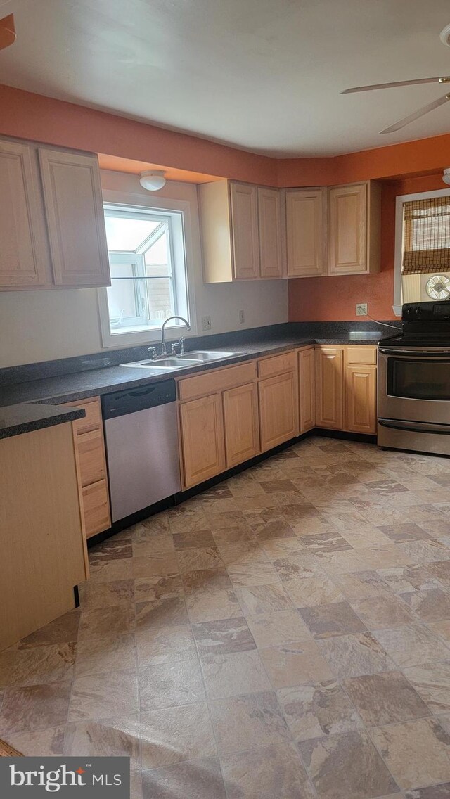 807 Riverside Dr, Pasadena, MD 21122 - kitchen featuring stainless steel appliances, a sink, and dark countertops
