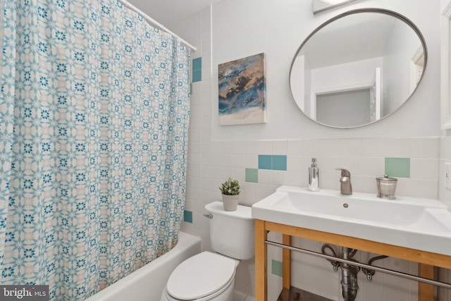 5439 Grove Ridge Way Unit 112, Rockville, MD 20852 - bathroom featuring toilet, tile walls, and shower / bathtub combination with curtain