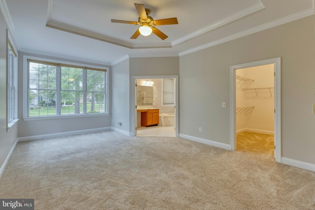 15201 Weiskopf Ct, Haymarket, VA 20169 - unfurnished bedroom with a raised ceiling, a spacious closet, light carpet, ornamental molding, and baseboards