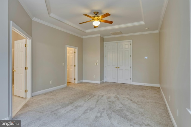 15201 Weiskopf Ct, Haymarket, VA 20169 - unfurnished bedroom with a tray ceiling, light carpet, ornamental molding, a closet, and baseboards