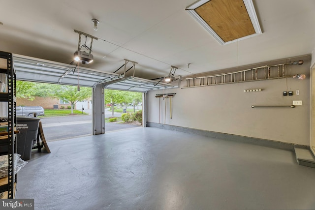 15201 Weiskopf Ct, Haymarket, VA 20169 - garage with a garage door opener and baseboards