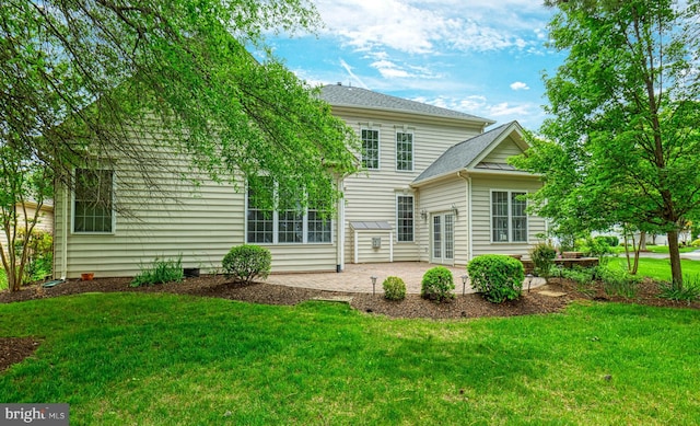 15201 Weiskopf Ct, Haymarket, VA 20169 - back of house featuring a patio, a lawn, a shingled roof, and french doors