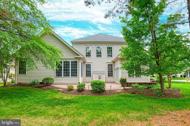 15201 Weiskopf Ct, Haymarket, VA 20169 - rear view of property with a patio area and a yard