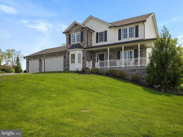 view of front of property featuring a porch, a garage, stone siding, and a front lawn