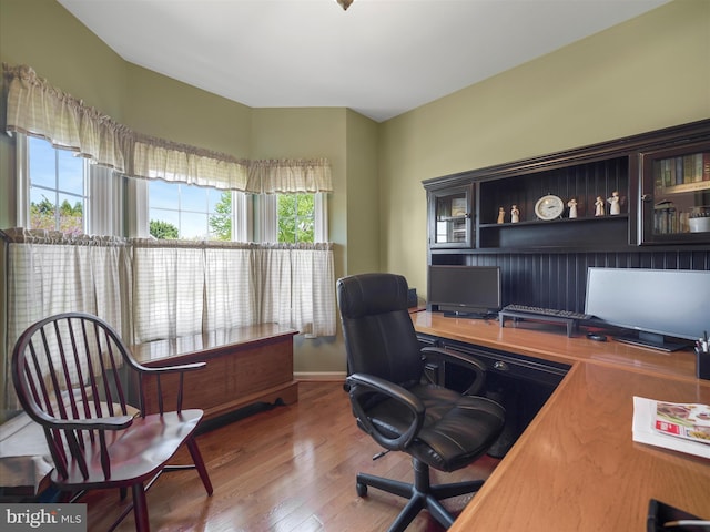 office space with wood finished floors