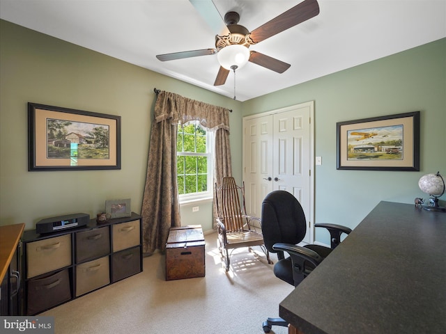 carpeted office with ceiling fan