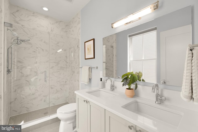 770 Park Rd NW Unit 201, Washington, DC 20010 - bathroom featuring a marble finish shower, double vanity, tile patterned flooring, and recessed lighting