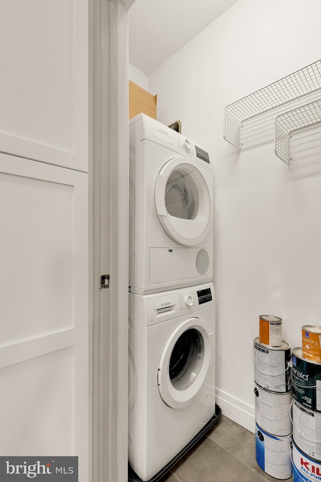 770 Park Rd NW Unit 201, Washington, DC 20010 - laundry room featuring stacked washer / dryer and baseboards