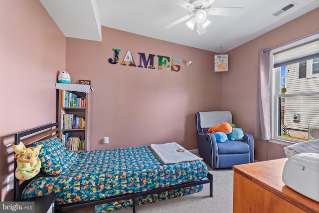 carpeted bedroom with ceiling fan and visible vents