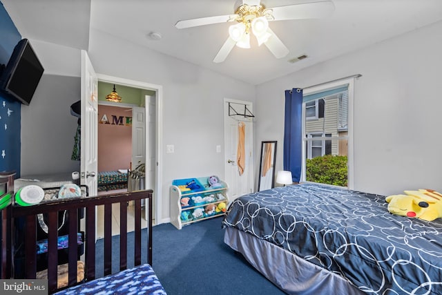 bedroom featuring carpet flooring, ceiling fan, visible vents, and lofted ceiling