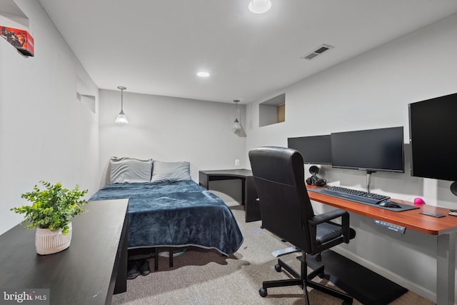 carpeted bedroom with visible vents and recessed lighting