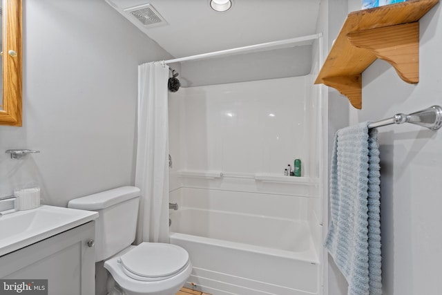 bathroom featuring shower / tub combo with curtain, vanity, toilet, and visible vents