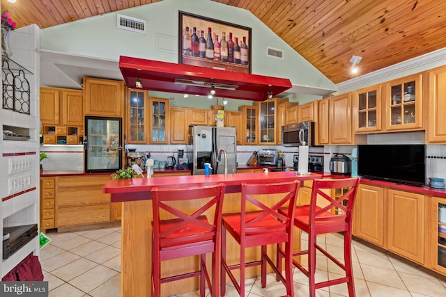 kitchen featuring visible vents, wood ceiling, light tile patterned flooring, and stainless steel appliances