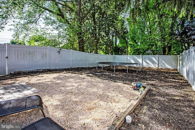 103 Dunn Ln, Pennsville, NJ 08070 - view of yard featuring a fenced backyard and a trampoline
