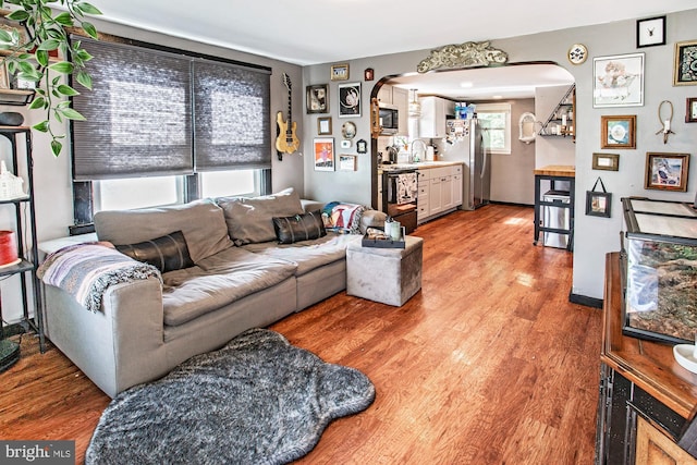 103 Dunn Ln, Pennsville, NJ 08070 - living room with arched walkways and light wood finished floors