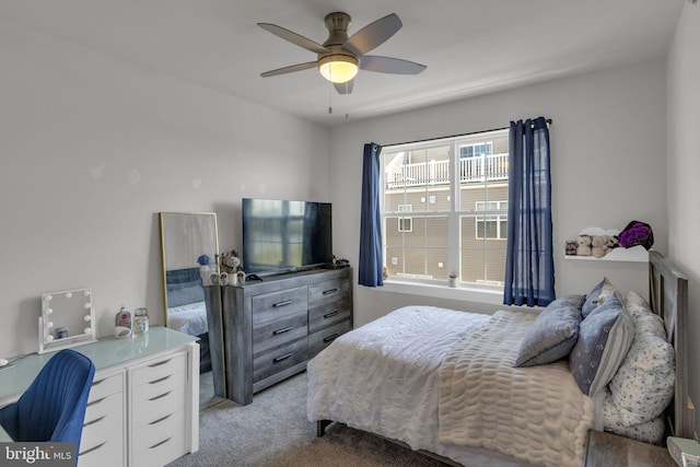 bedroom with ceiling fan and light carpet