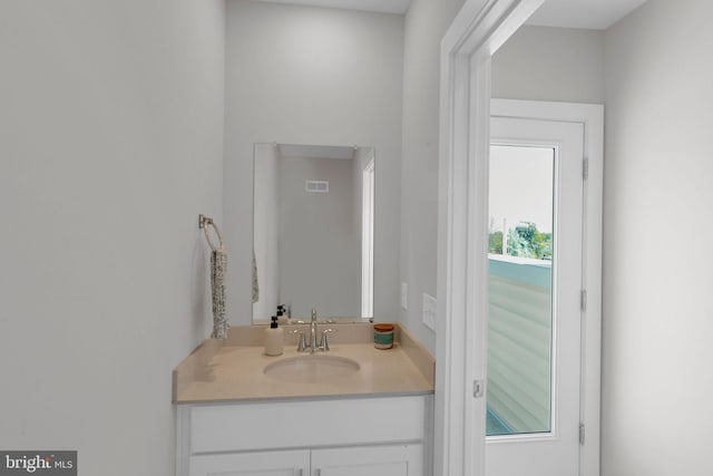 bathroom with vanity and visible vents