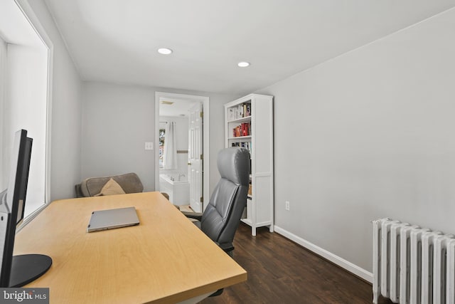 office space featuring radiator heating unit, recessed lighting, baseboards, and dark wood finished floors