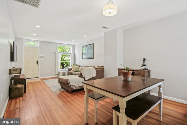 dining room featuring recessed lighting, baseboards, visible vents, and light wood-type flooring