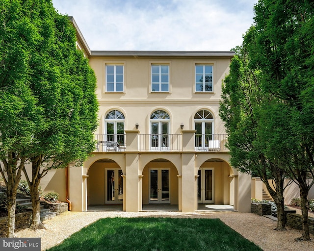2740 Chain Bridge Rd NW, Washington, DC 20016 - rear view of property featuring stucco siding, french doors, and a balcony