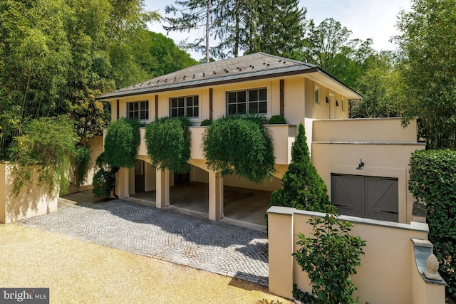 2740 Chain Bridge Rd NW, Washington, DC 20016 - view of front facade with metal roof and stucco siding