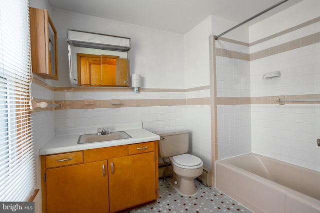 full bathroom with tile walls, shower / tub combination, tile patterned floors, vanity, and toilet