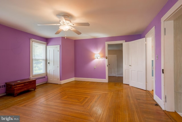 unfurnished bedroom featuring baseboards and a ceiling fan