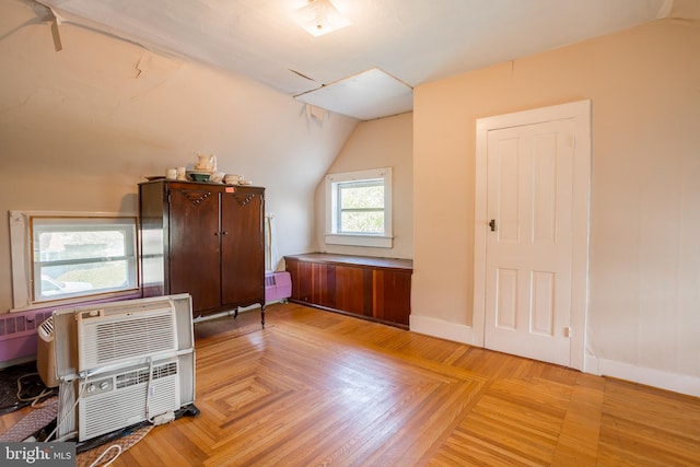 bonus room featuring baseboards and vaulted ceiling