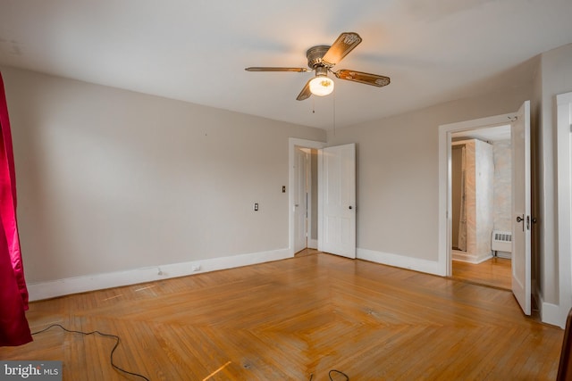 unfurnished bedroom with baseboards and ceiling fan