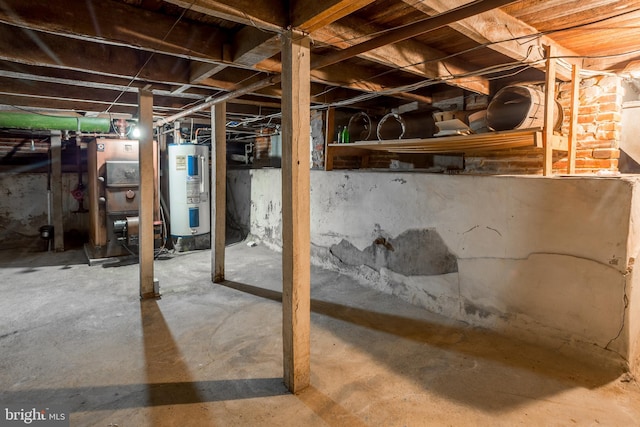 unfinished below grade area with heating unit and electric water heater