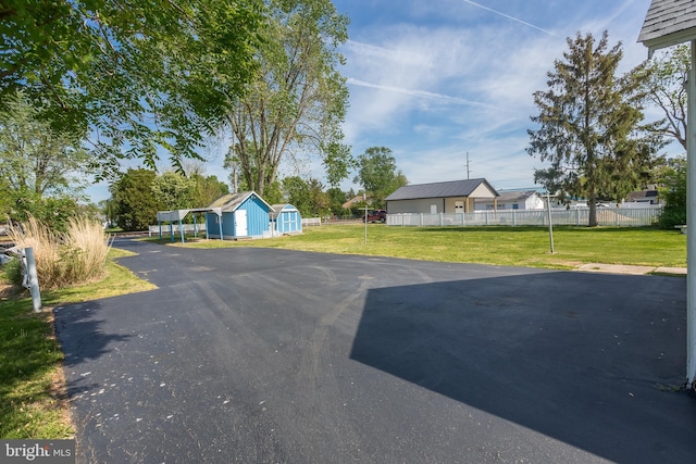 view of road with aphalt driveway