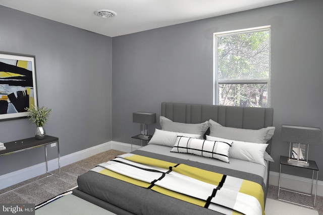 bedroom with visible vents, baseboards, and carpet floors