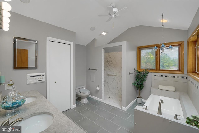 full bath with a ceiling fan, a bath, vaulted ceiling, a sink, and toilet