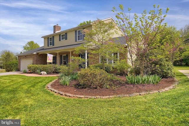 view of front of house featuring a garage, a chimney, a front yard, and brick siding