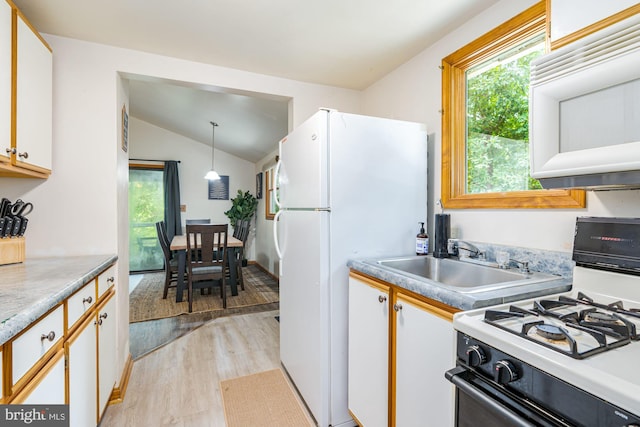 371 Oak Hill Rd, Berkeley Springs, WV 25411 - kitchen with white appliances, white cabinets, a sink, light wood-style flooring, and vaulted ceiling