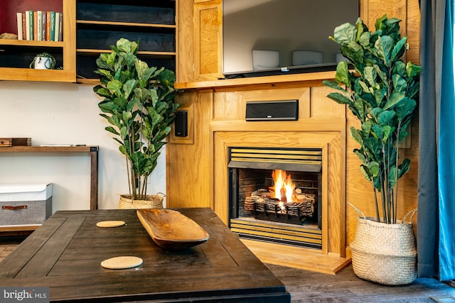 371 Oak Hill Rd, Berkeley Springs, WV 25411 - interior details featuring a lit fireplace and wood finished floors
