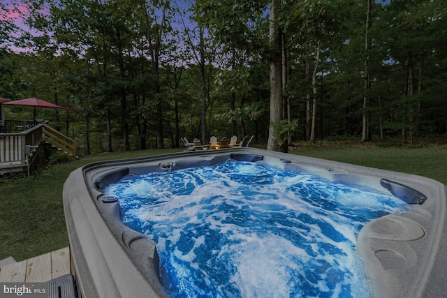 371 Oak Hill Rd, Berkeley Springs, WV 25411 - view of swimming pool featuring a view of trees, a hot tub, a wooden deck, and stairway