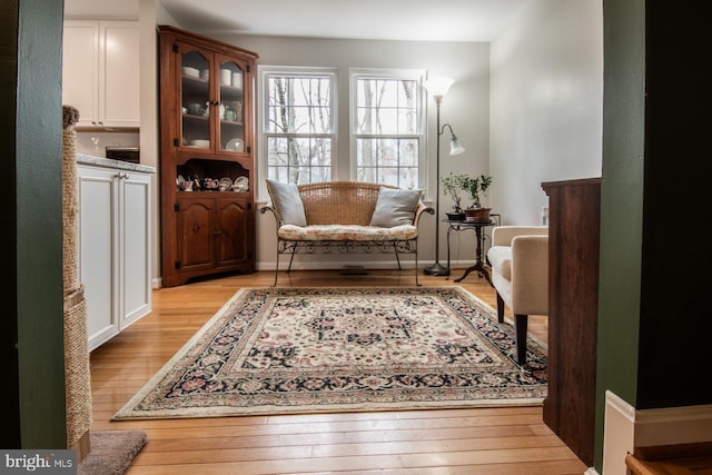sitting room featuring light wood-style flooring