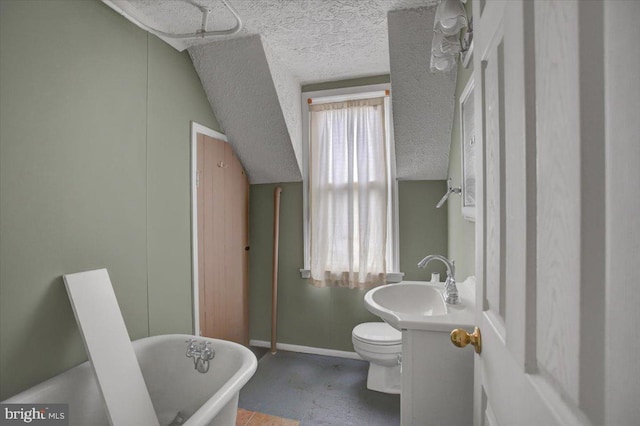 125 Cottage St, Waynesboro, PA 17268 - full bath with a soaking tub, a textured ceiling, baseboards, vanity, and toilet