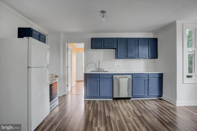125 Cottage St, Waynesboro, PA 17268 - kitchen with stainless steel appliances, a sink, blue cabinetry, wood finished floors, and ornamental molding