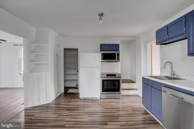 125 Cottage St, Waynesboro, PA 17268 - kitchen with stainless steel appliances, blue cabinets, a sink, dark wood-style floors, and light countertops