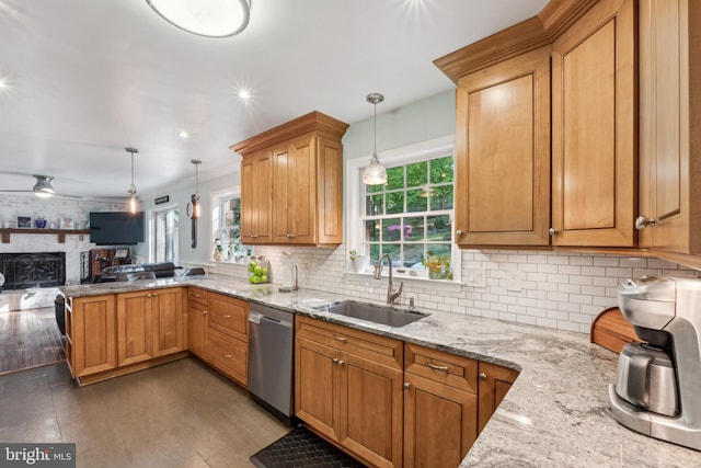 kitchen featuring open floor plan, plenty of natural light, a sink, and dishwasher